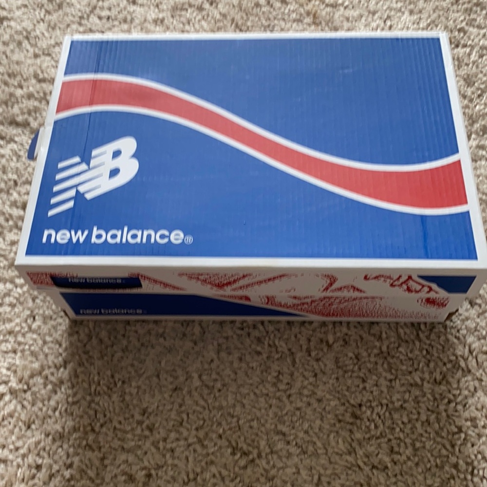 Red New Balance with leopard print in the inside